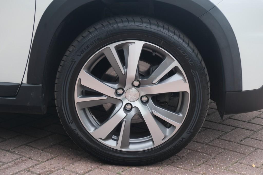 Peugeot 2008 1.2 PureTech 130pk Blue Lease Allure | Navi | App Connect | Climate | Cruise | Camera | Panoramadak afbeelding 29