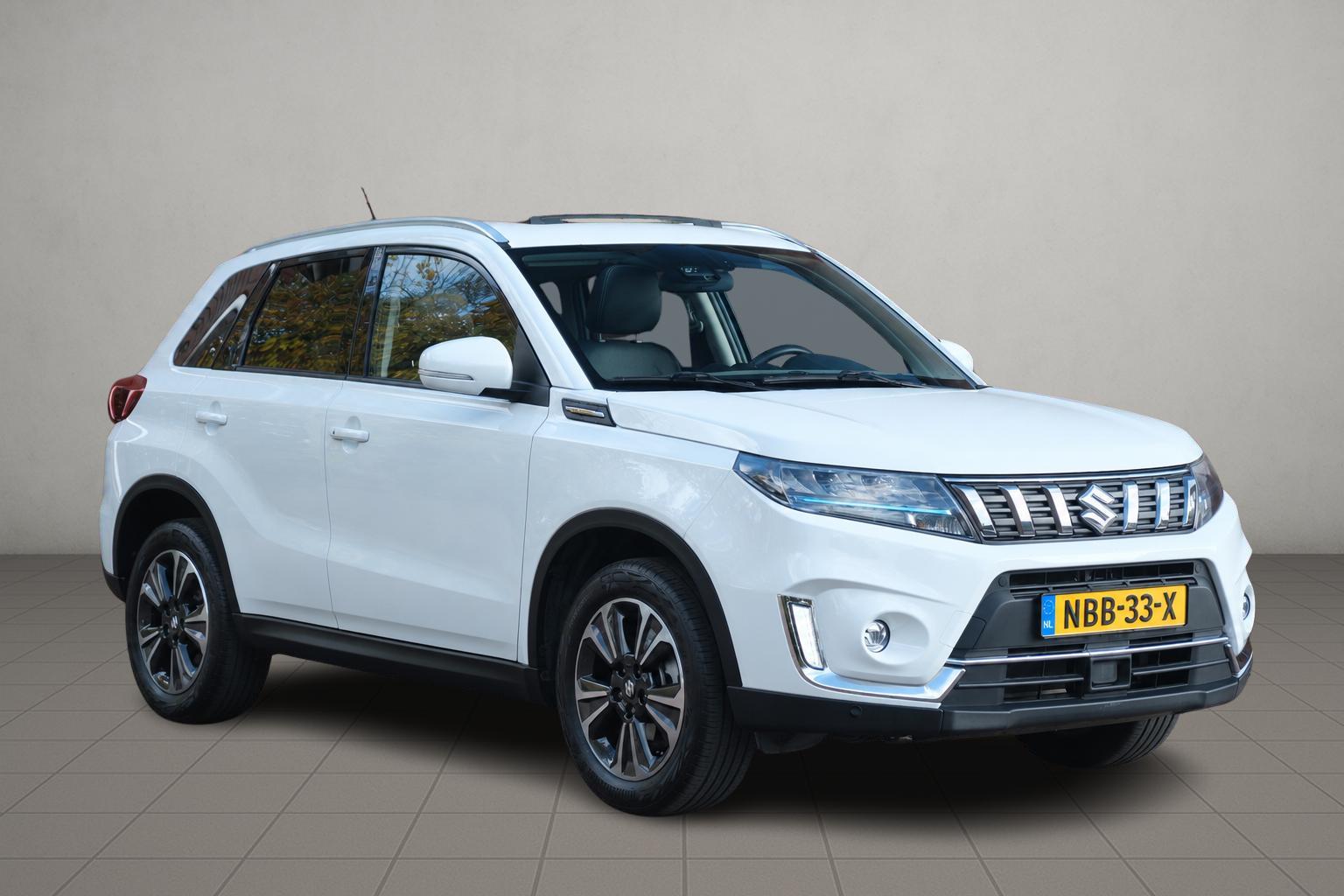 Suzuki Vitara 1.5 Hybrid Aut. Style - Panoramadak - Adaptieve cruise - Achteruitrijcamera - Dodehoekdetectie - Apple CarPlay - Navigatiesysteem - Keyless - Stoelverwarming - Parkeersensoren afbeelding 1
